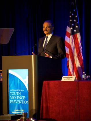 U.S. Attorney General Eric Holder speaking at the Summit on Preventing Youth Violence in April 2011
