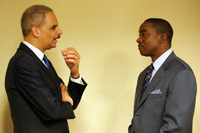 The Honorable Eric H. Holder, Jr., Attorney General of the United States, with Isaiah Thomas